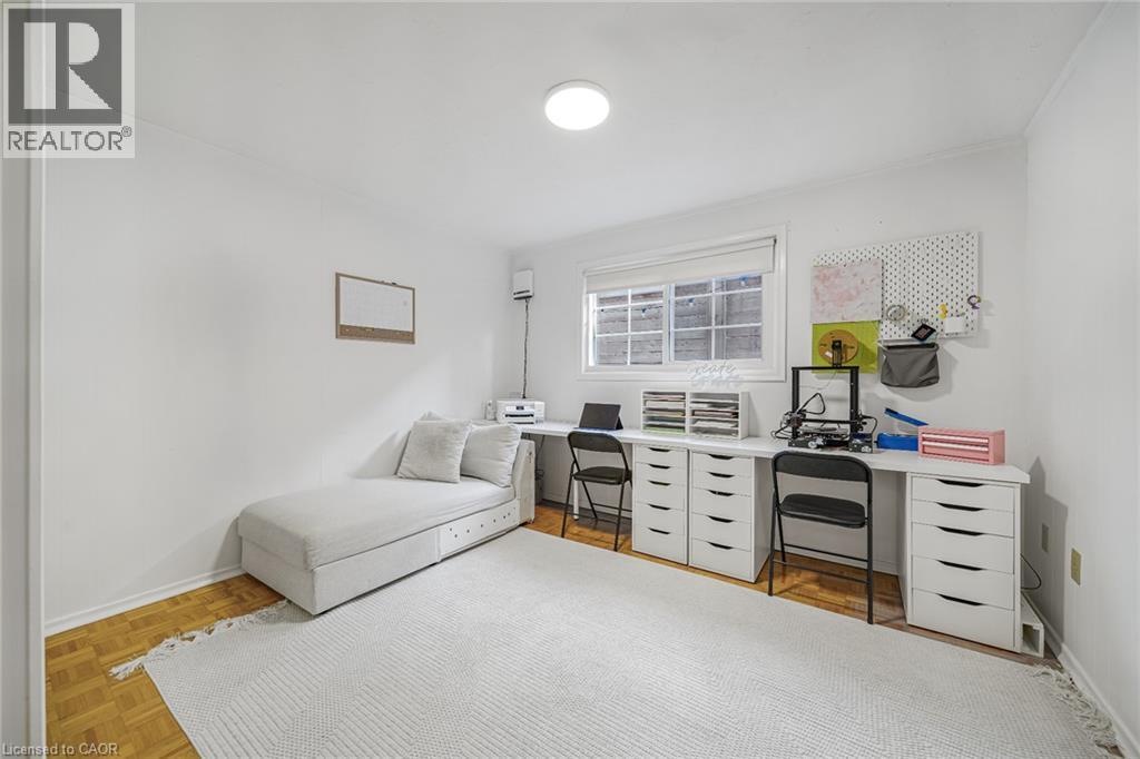 Recessed window, wood-finish flooring, white walls, and a ceiling-mounted light fixture - 24 Garvey Crescent, Hamilton, ON - Indoor Photo Showing Bedroom