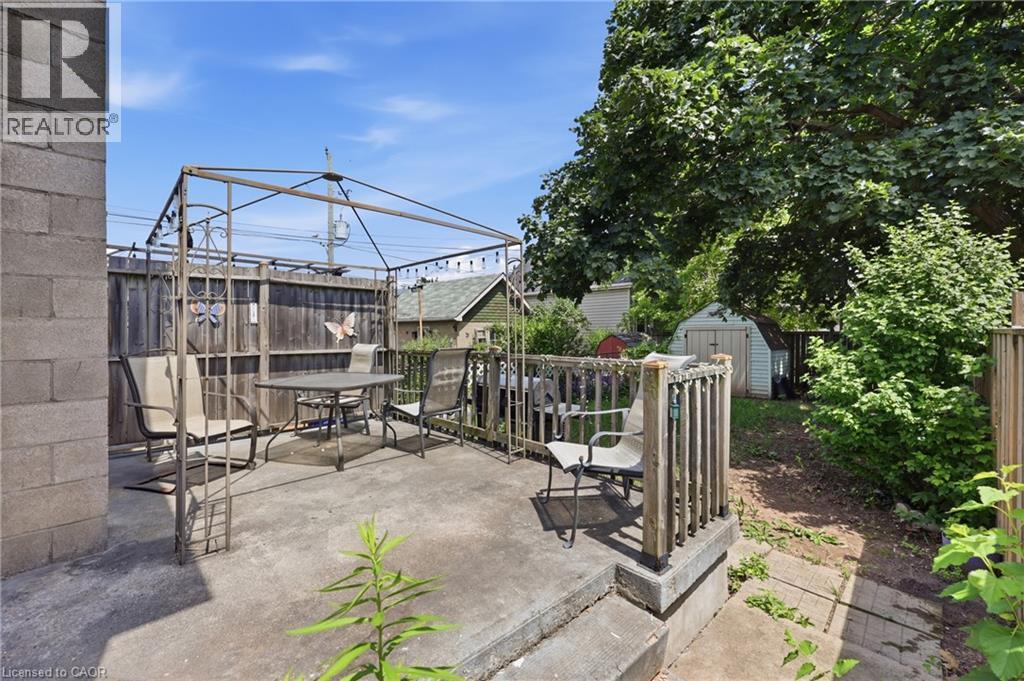 Concrete patio surface with a metal gazebo structure - 56 Harmony Avenue, Hamilton, ON - Outdoor