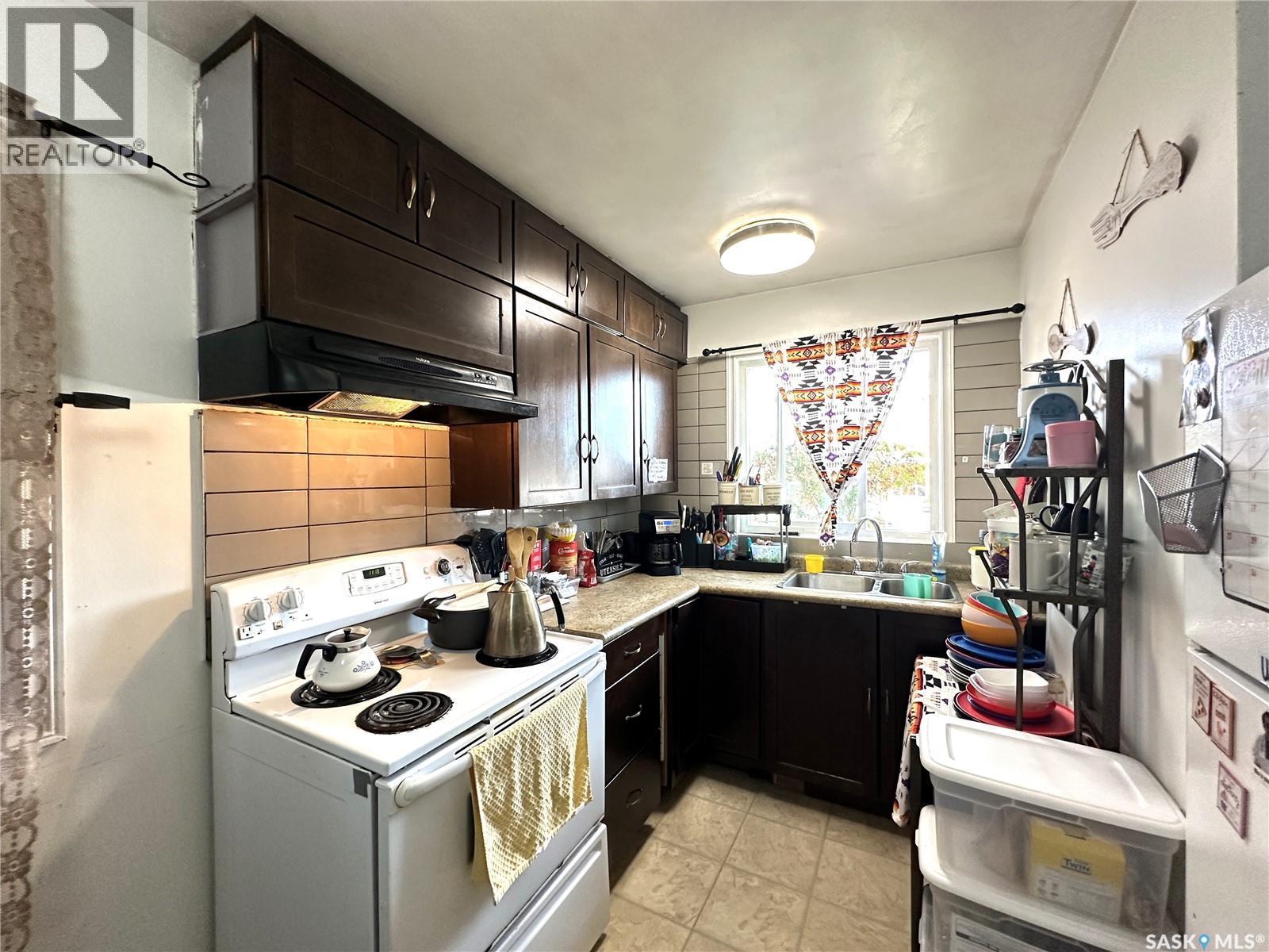 A&B 2818 7Th Street E, Saskatoon, SK - Indoor Photo Showing Kitchen With Double Sink