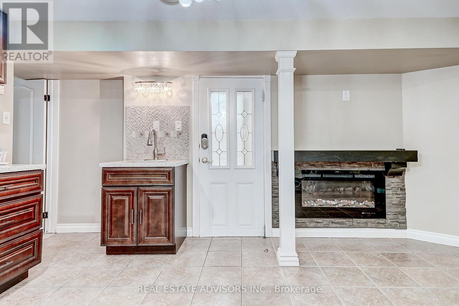 Basement Electrical Fireplace - 1228 Jane Street N, Toronto, ON - Indoor With Fireplace