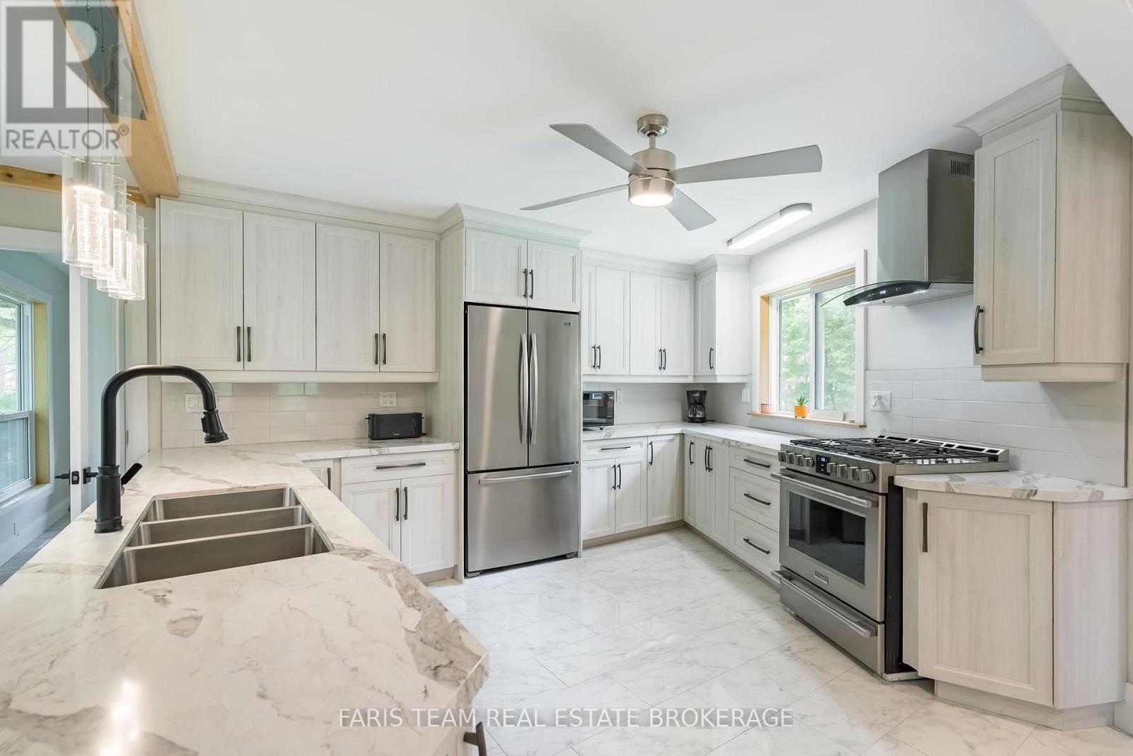 Virtually Staged - 8 Joliet Crescent, Tiny, ON - Indoor Photo Showing Kitchen With Double Sink With Upgraded Kitchen