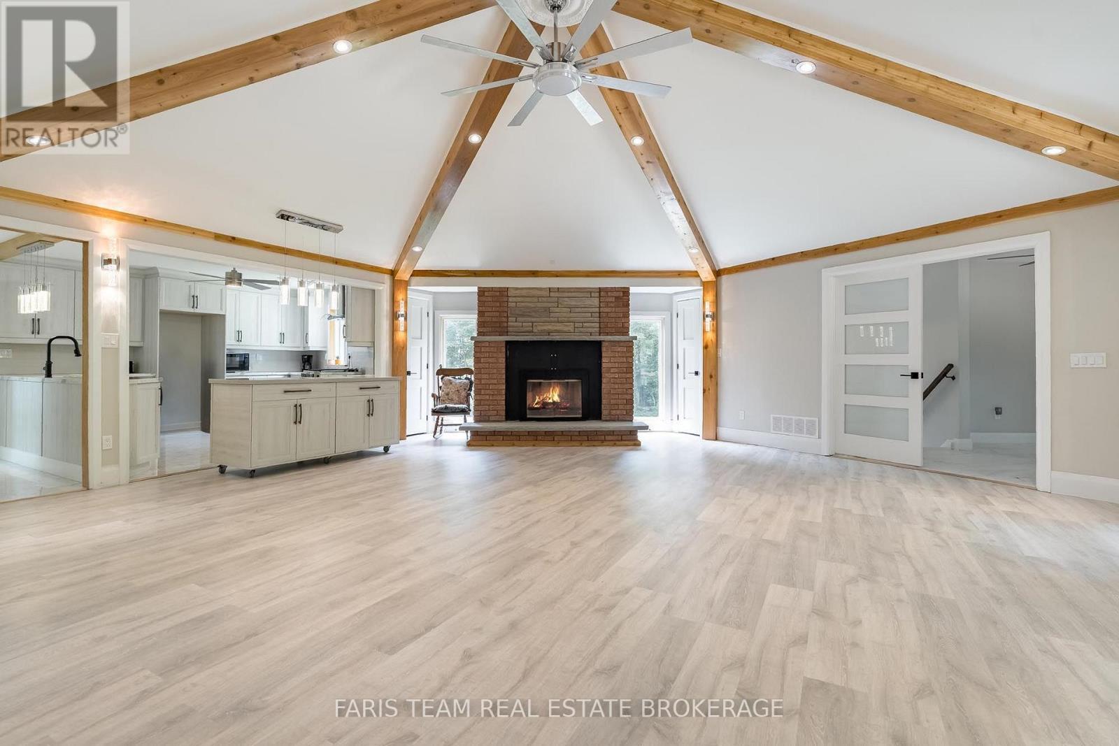 8 Joliet Crescent, Tiny, ON - Indoor Photo Showing Living Room With Fireplace