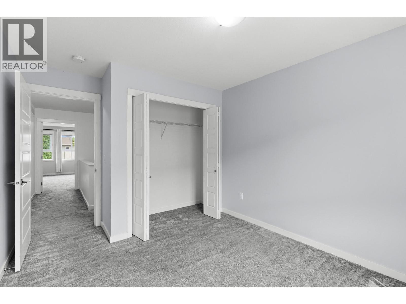 2nd bedroom- upper level - 680 Old Meadows Road Unit# 74, Kelowna, BC - Indoor Photo Showing Other Room
