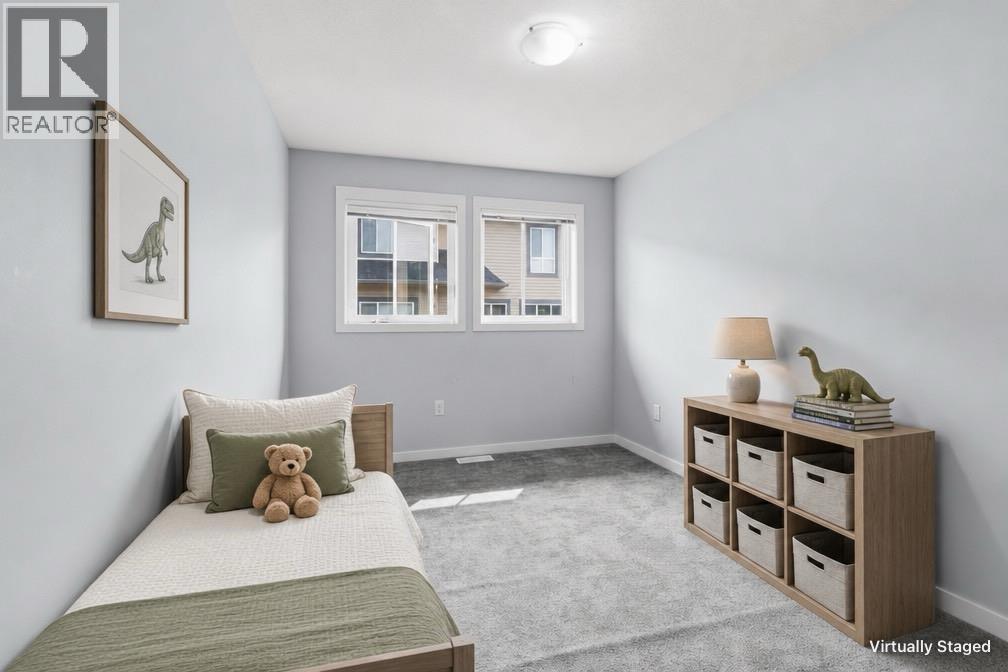3rd bedroom- virtually staged with furniture - 680 Old Meadows Road Unit# 74, Kelowna, BC - Indoor Photo Showing Bedroom
