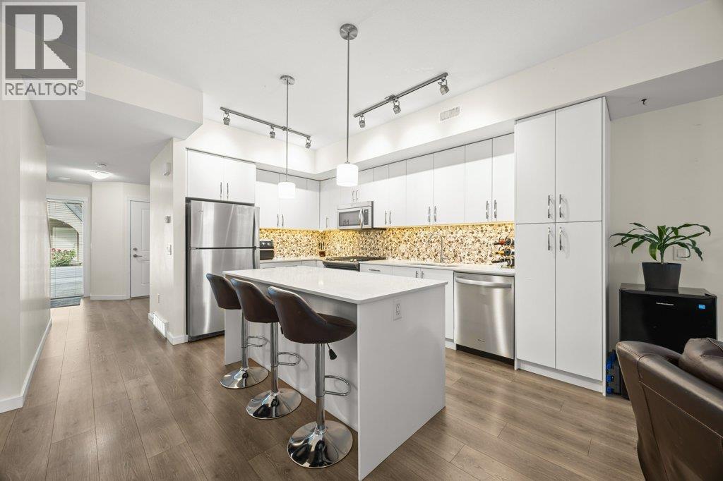 Kitchen with island seating - 680 Old Meadows Road Unit# 74, Kelowna, BC - Indoor Photo Showing Kitchen With Stainless Steel Kitchen With Upgraded Kitchen