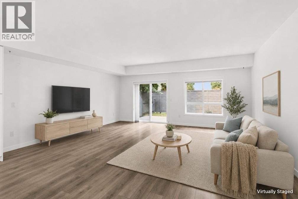 Main floor living room - virtually staged furniture - 680 Old Meadows Road Unit# 74, Kelowna, BC - Indoor Photo Showing Living Room