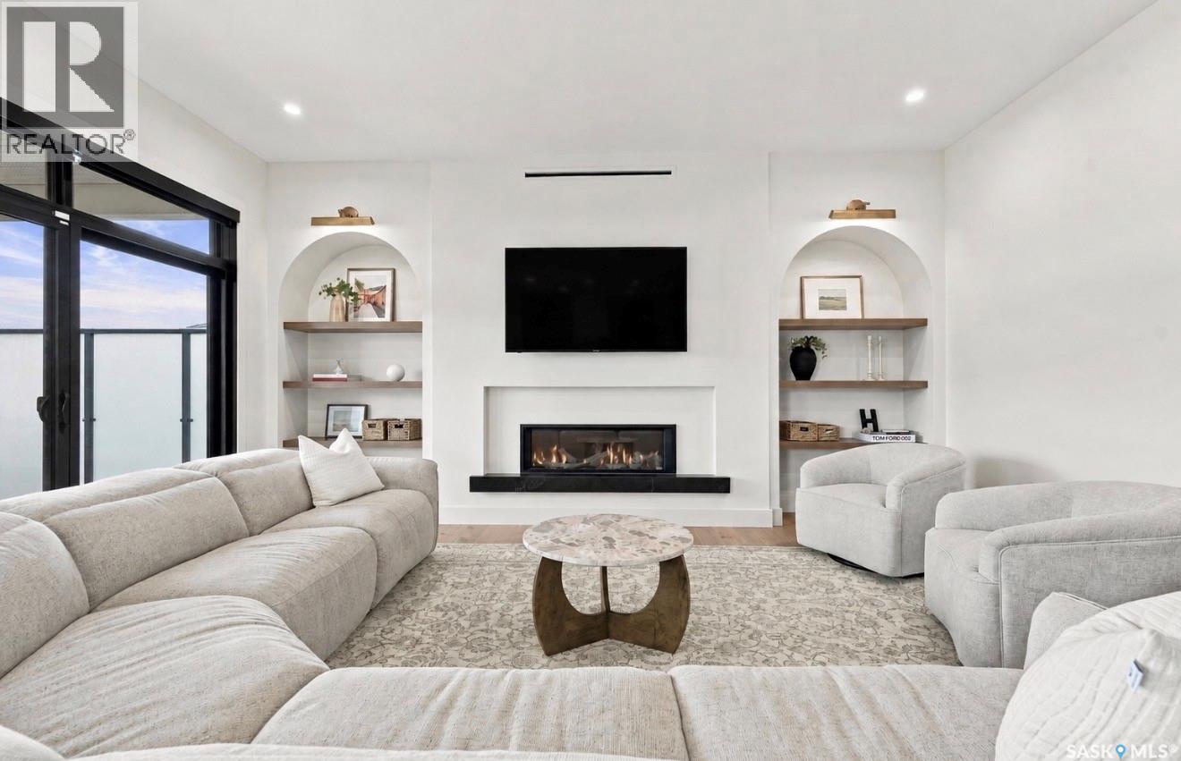 652 Pepper Bend, Saskatoon, SK - Indoor Photo Showing Living Room With Fireplace