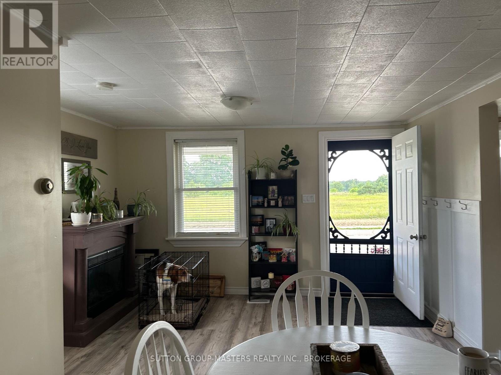 1609 County Road 42 Road, Rideau Lakes, ON - Indoor Photo Showing Dining Room With Fireplace