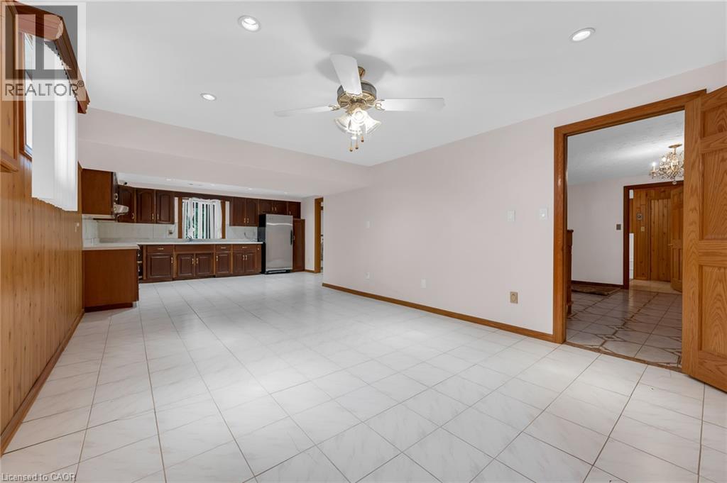 Expansive room with white tile flooring, recessed lighting, and a ceiling fan - 35 Glen Park Court, Hamilton, ON - Indoor Photo Showing Other Room