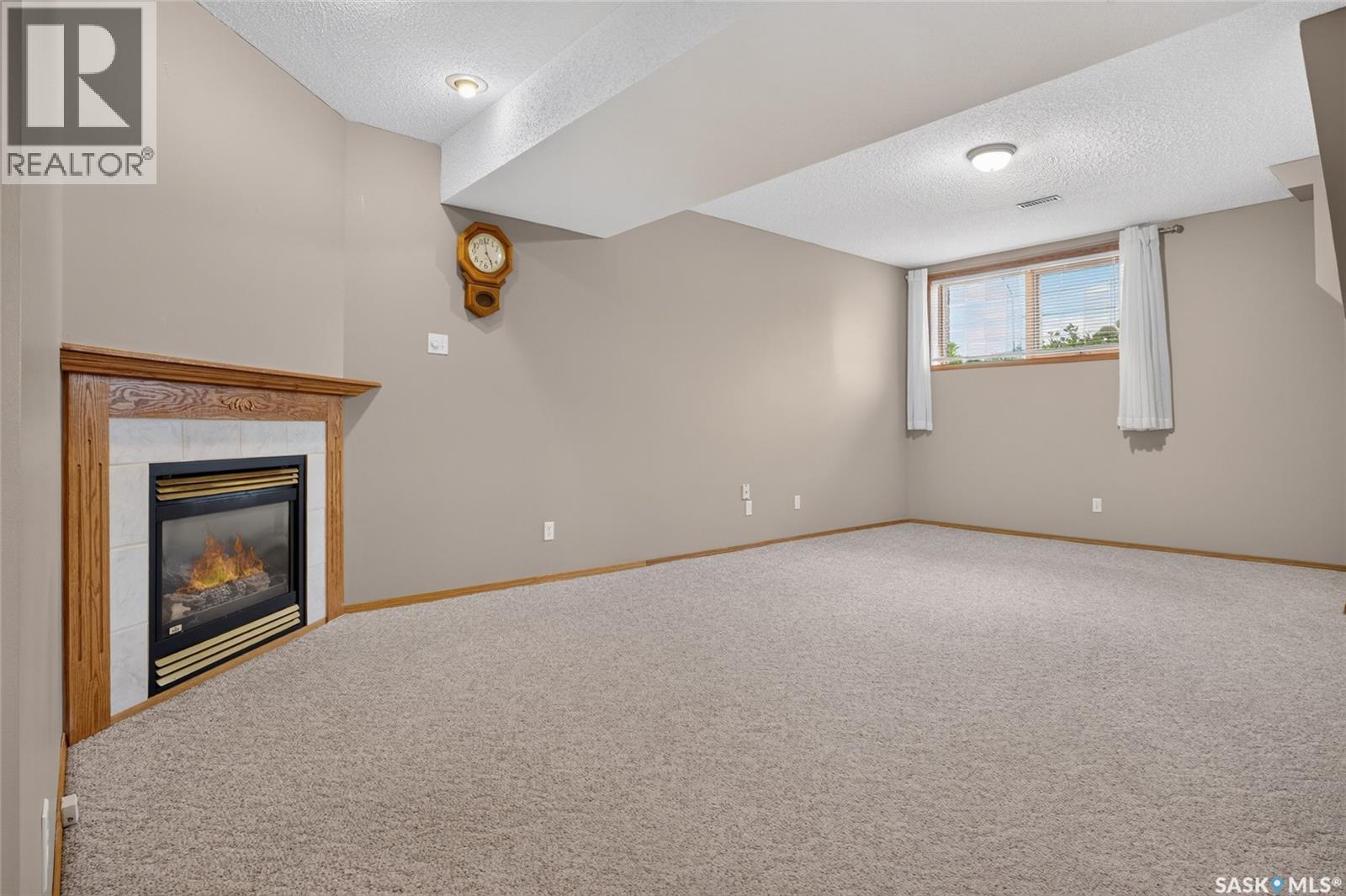 3547 Hazel Grove, Regina, SK - Indoor Photo Showing Other Room With Fireplace