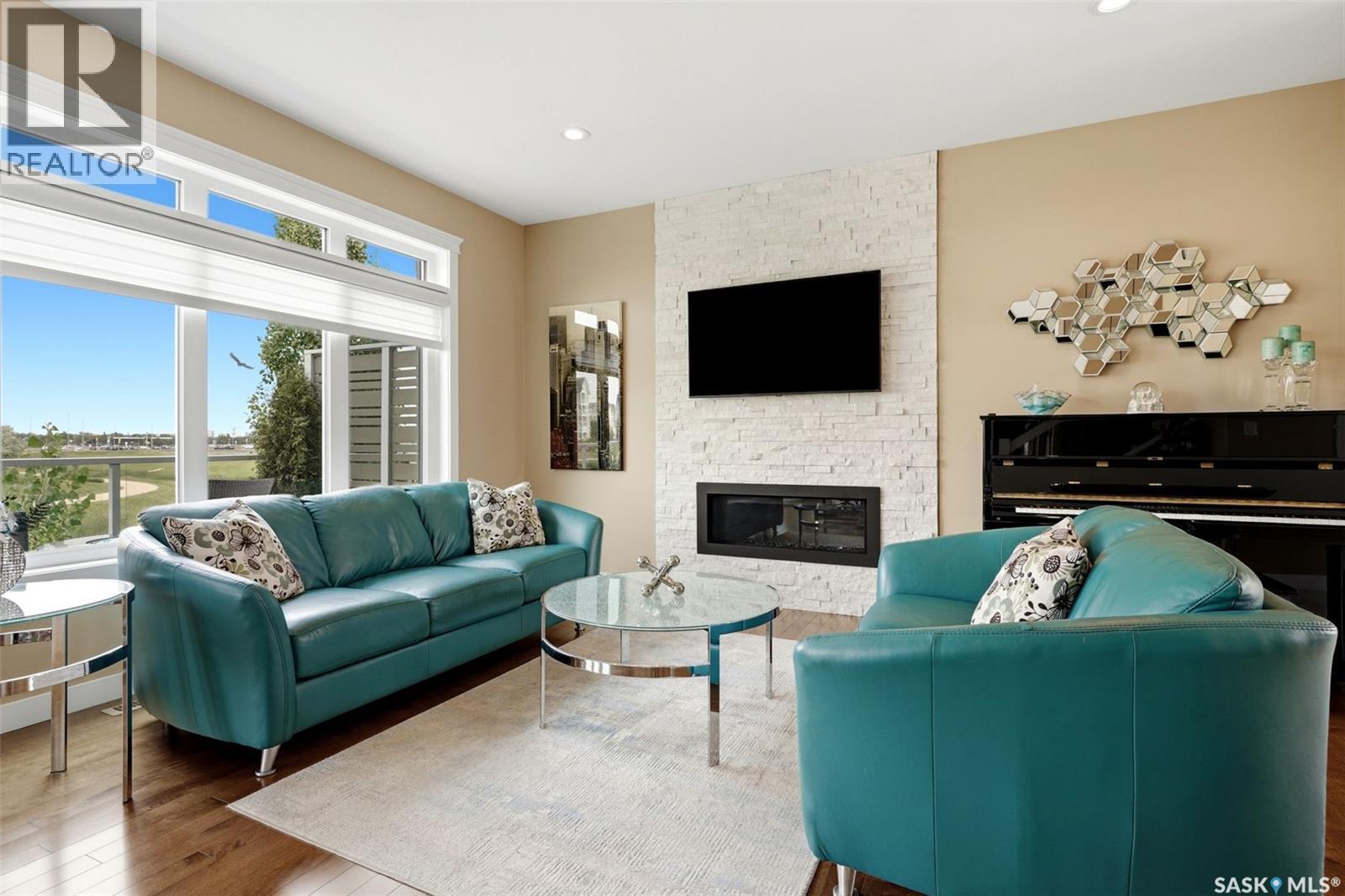 4665 Skinner Crescent, Regina, SK - Indoor Photo Showing Living Room With Fireplace