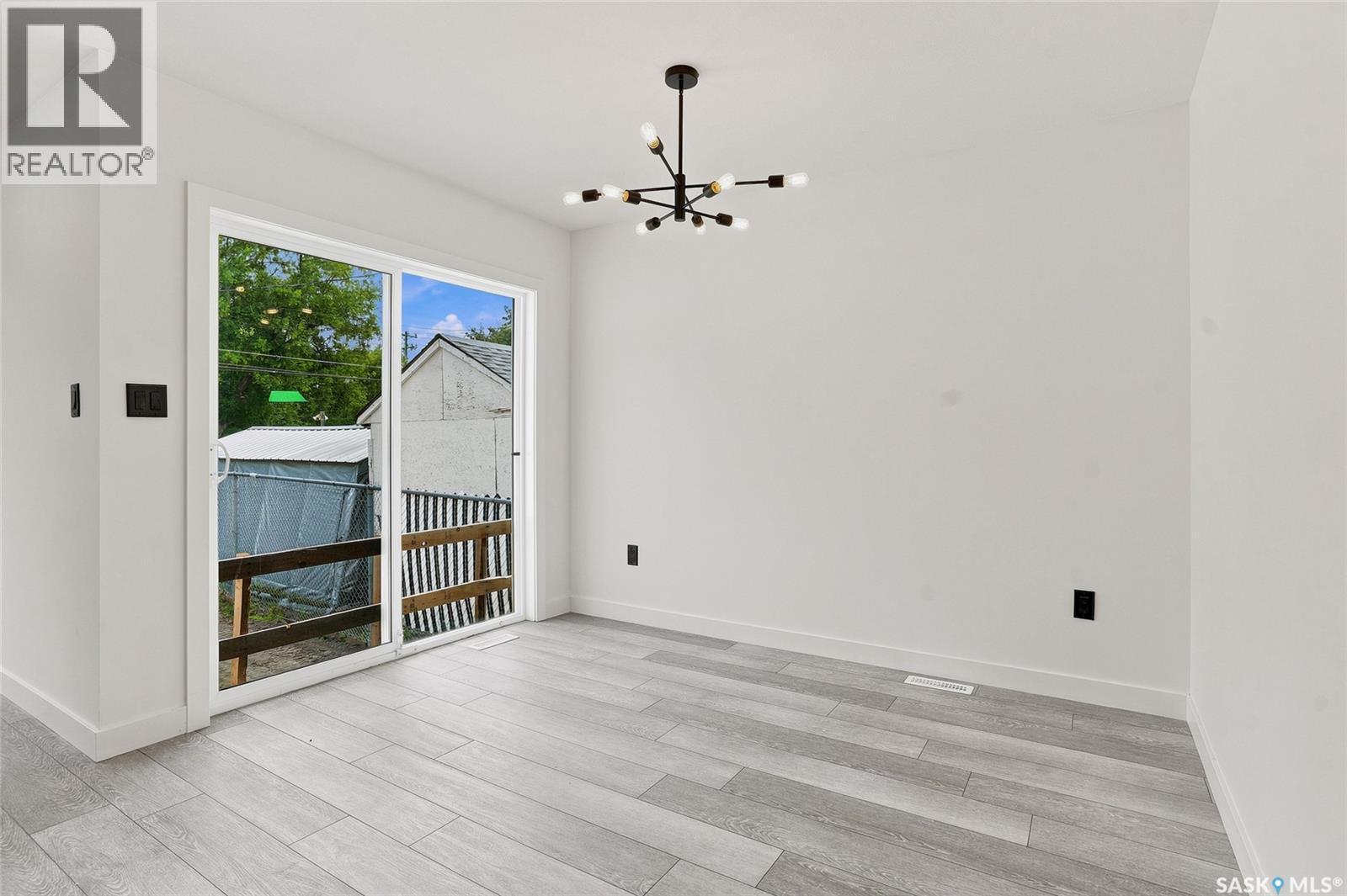 1220 H Avenue N, Saskatoon, SK - Indoor Photo Showing Other Room With Fireplace