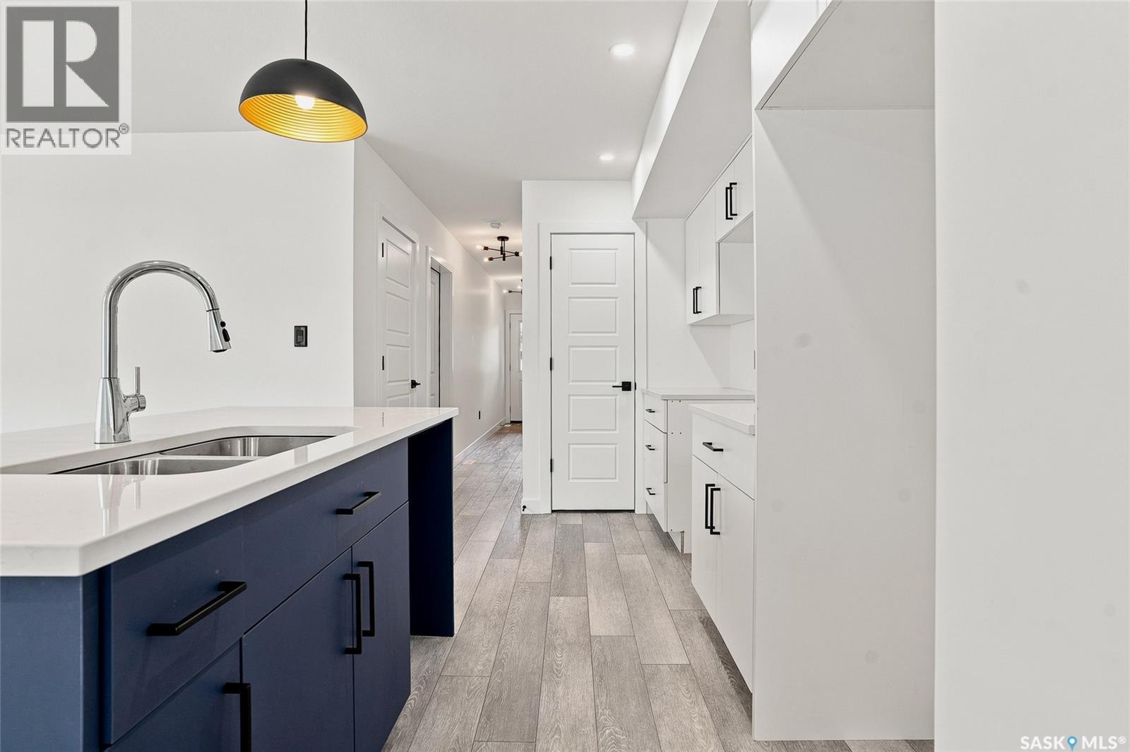 1220 H Avenue N, Saskatoon, SK - Indoor Photo Showing Kitchen With Double Sink