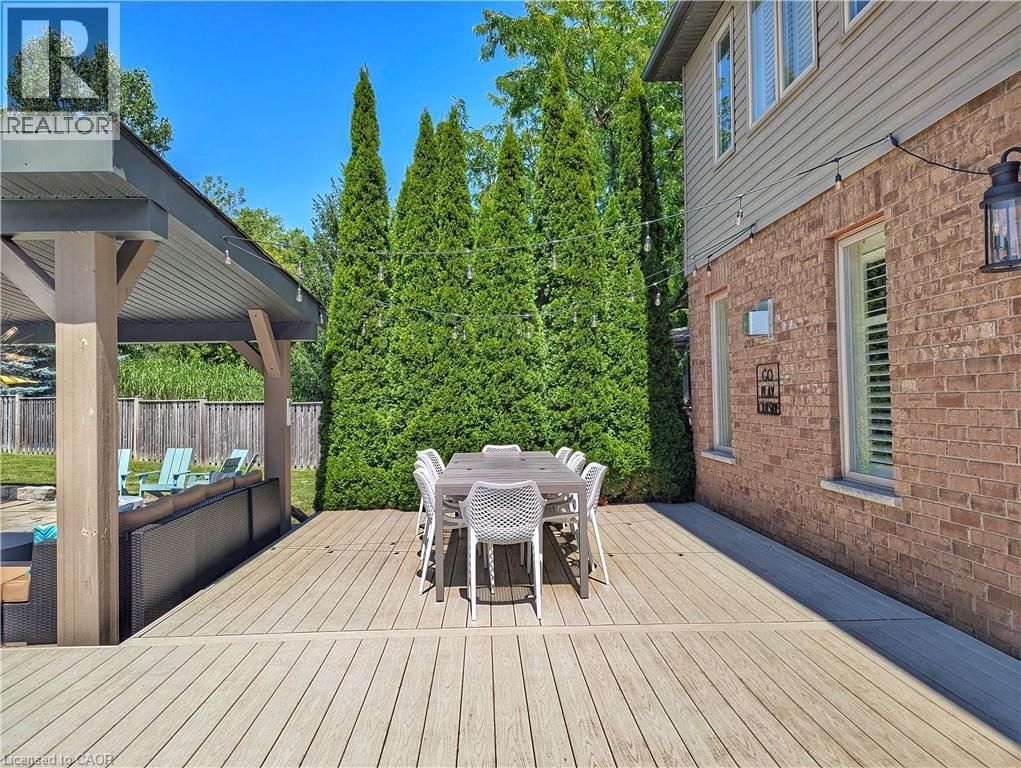 Expansive outdoor decking with a covered pergola - 913 Valebrook Court, Kitchener, ON - Outdoor With Deck Patio Veranda