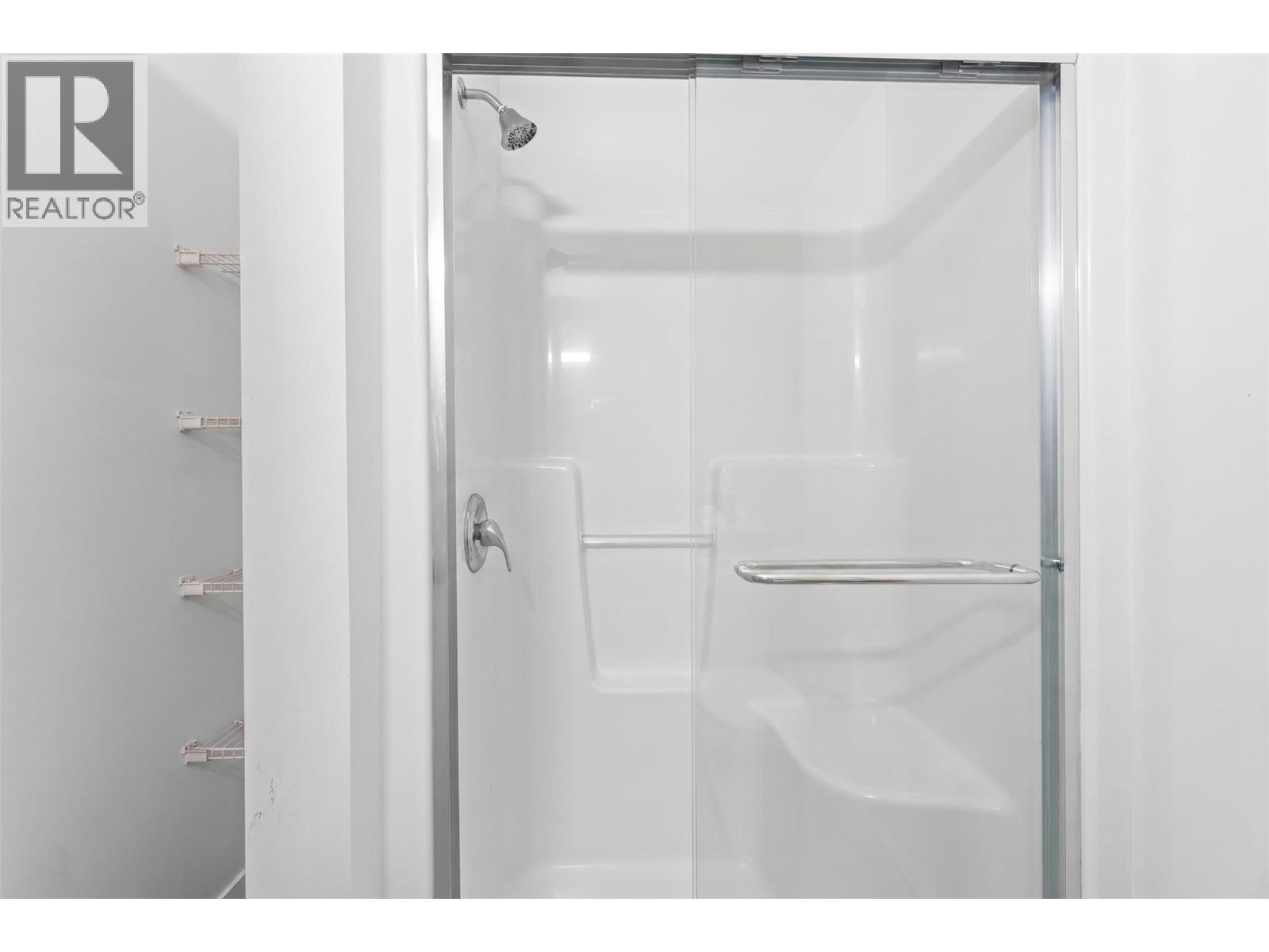Virtually staged to showcase potential use of space - 2345 Butt Road Unit# 415, West Kelowna, BC - Indoor Photo Showing Bathroom