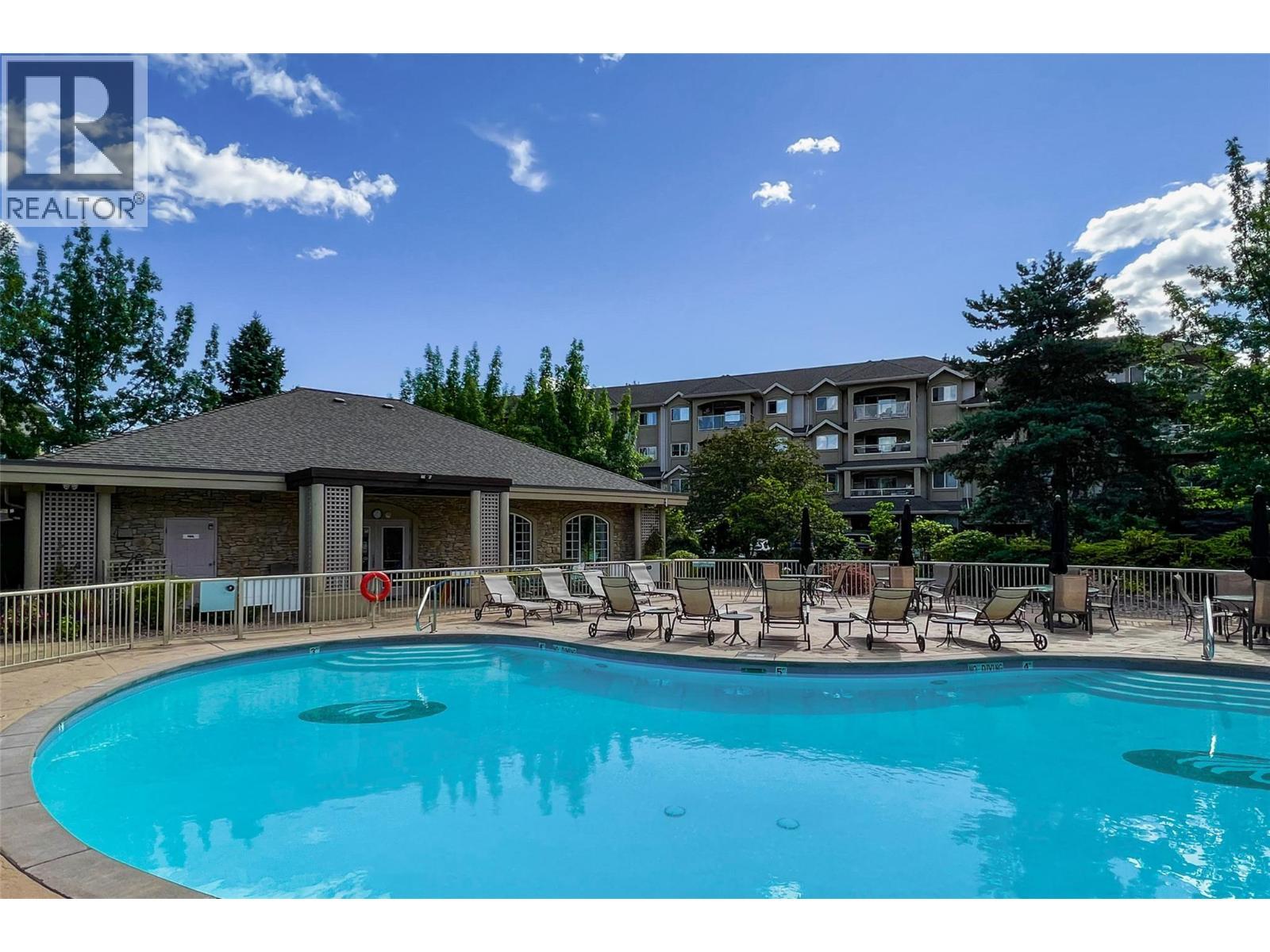1962 Enterprise Way Unit# 401, Kelowna, BC - Outdoor With In Ground Pool