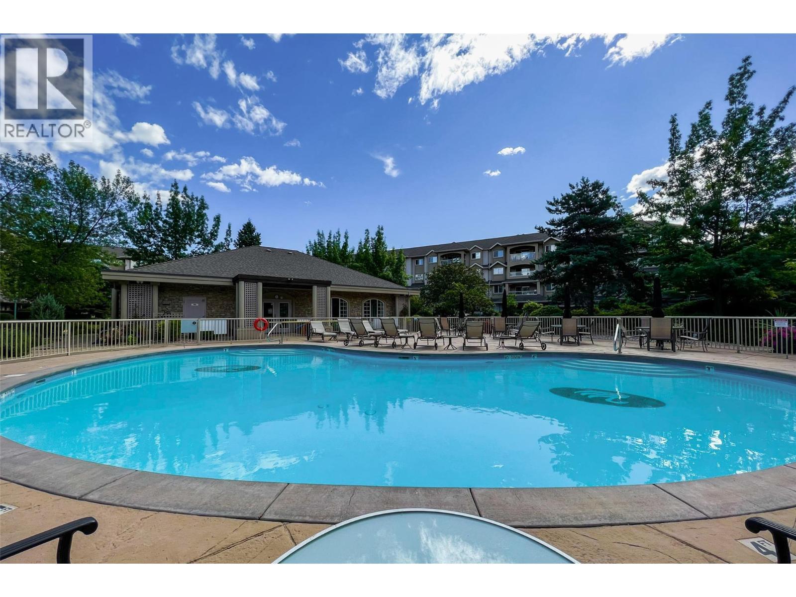 1962 Enterprise Way Unit# 401, Kelowna, BC - Outdoor With In Ground Pool With Backyard