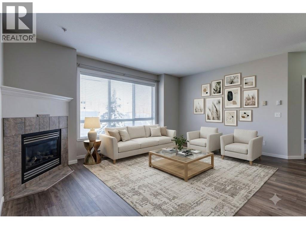 Living Room Virtually Staged - 1962 Enterprise Way Unit# 401, Kelowna, BC - Indoor Photo Showing Living Room With Fireplace