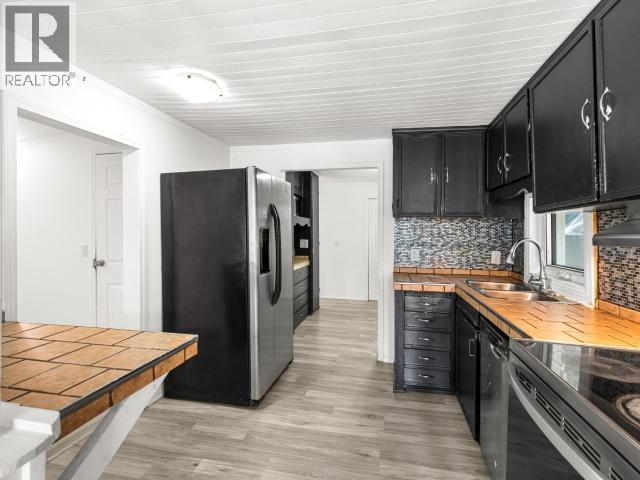 200-26 Azure Road, Whitehorse, YT - Indoor Photo Showing Kitchen With Double Sink