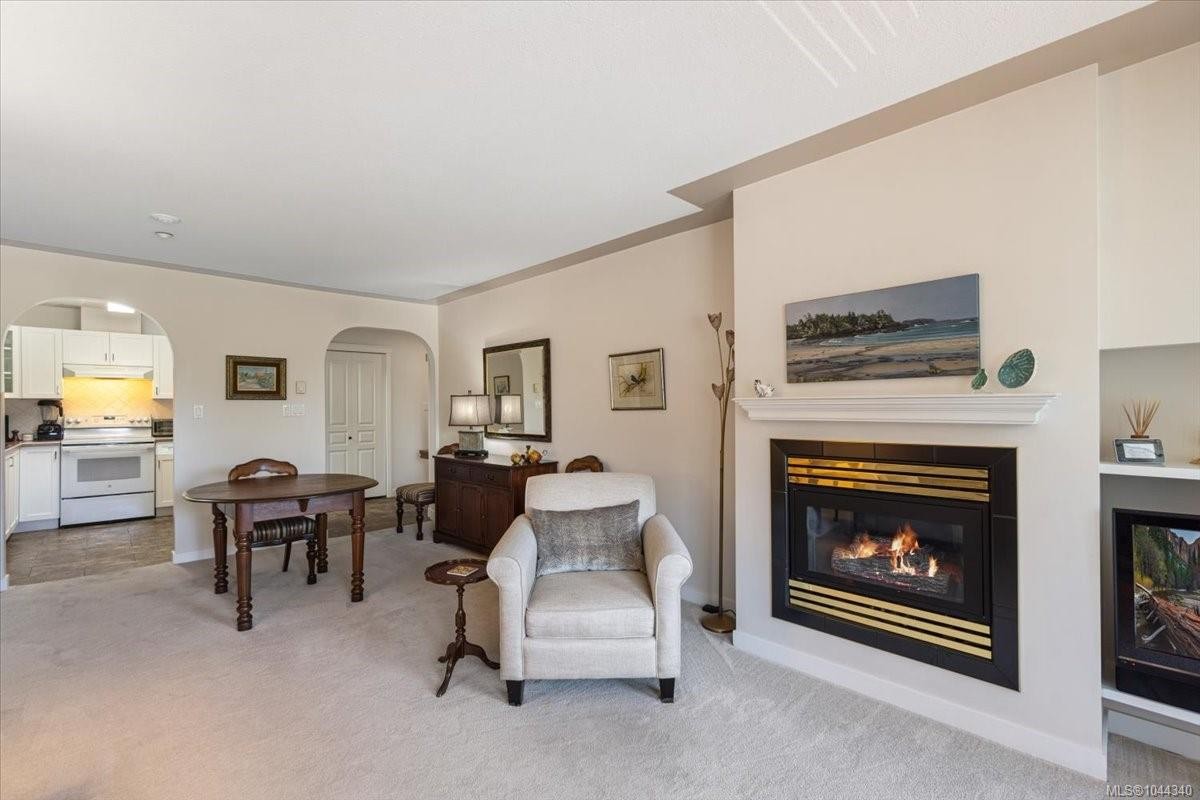 #307-6738 Dickinson Rd, Nanaimo, BC - Indoor Photo Showing Living Room With Fireplace