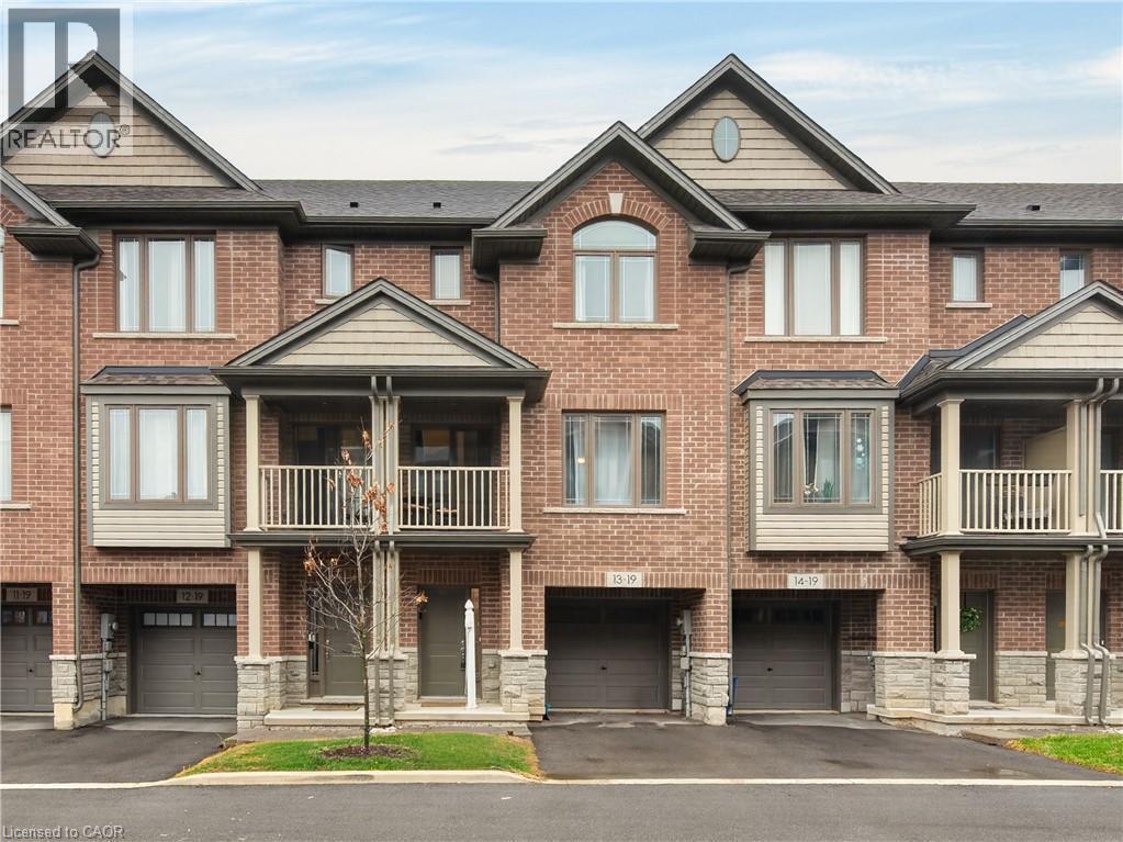 Brick townhouse exterior with multiple gables and dormers - 19 Picardy Drive Unit# 13, Hamilton, ON - Outdoor With Facade