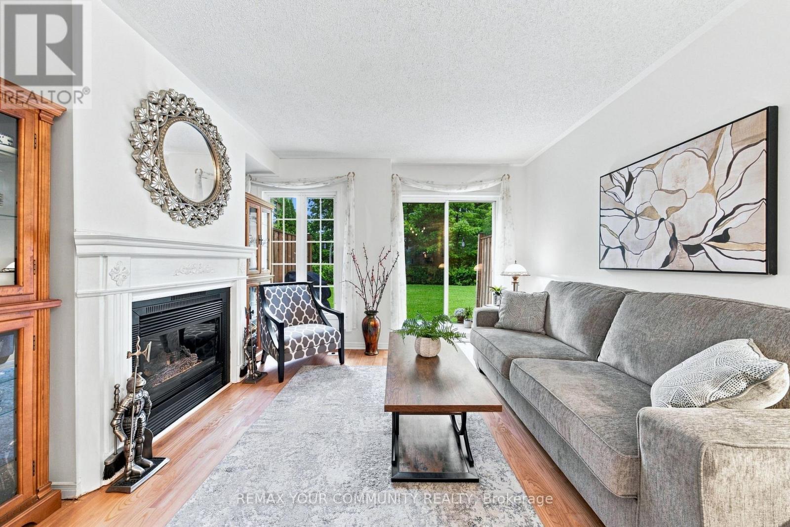 11 - 210 Manitoba Street, Toronto, ON - Indoor Photo Showing Living Room With Fireplace