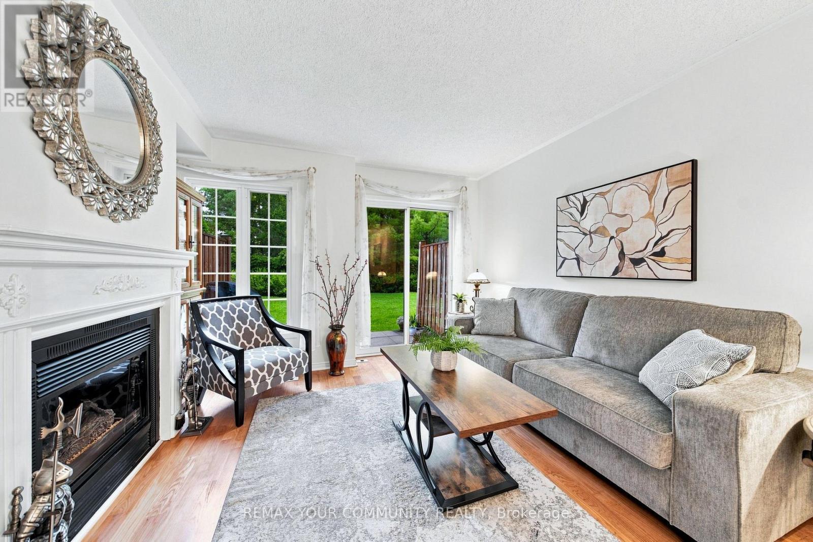 11 - 210 Manitoba Street, Toronto, ON - Indoor Photo Showing Living Room With Fireplace