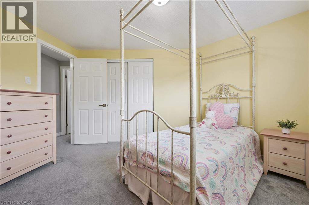 Plush carpet flooring, recessed lighting, and a closet with bi-fold doors - 60 Elmsdale Drive Unit# 25, Kitchener, ON - Indoor Photo Showing Bedroom