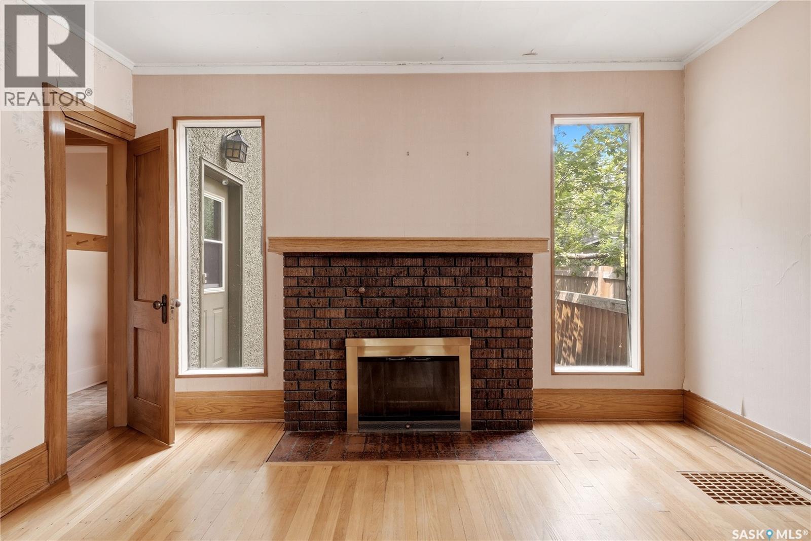 21 Angus Crescent, Regina, SK - Indoor Photo Showing Living Room With Fireplace