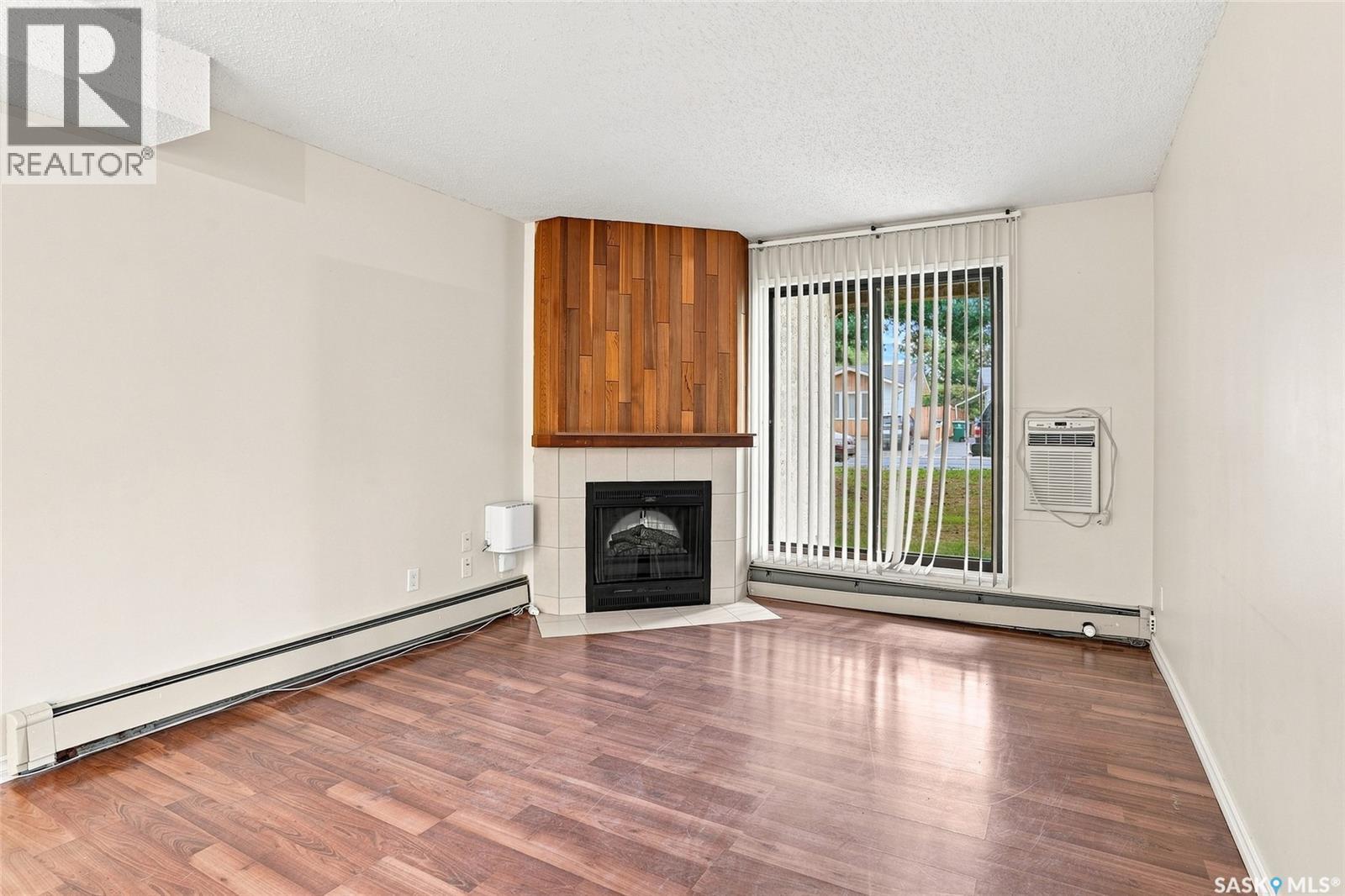 614 310 Stillwater Drive, Saskatoon, SK - Indoor Photo Showing Other Room With Fireplace
