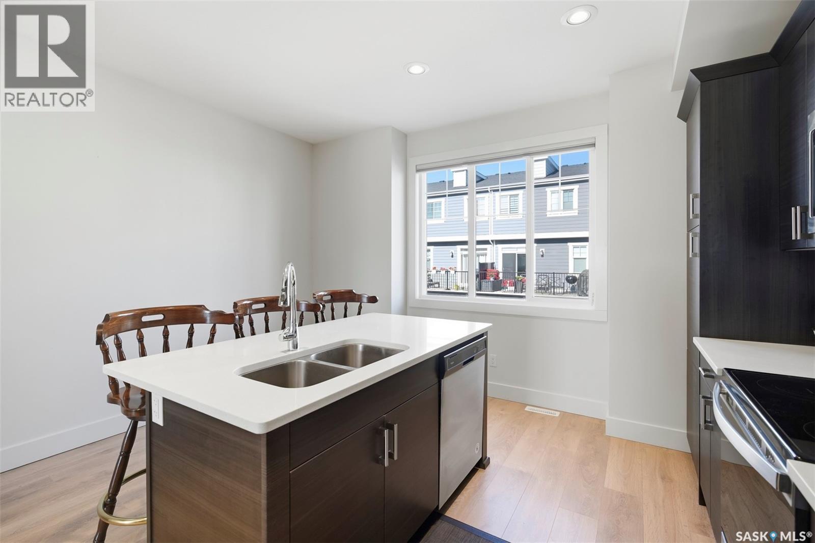 618 701 Meadows Boulevard, Saskatoon, SK - Indoor Photo Showing Kitchen With Double Sink