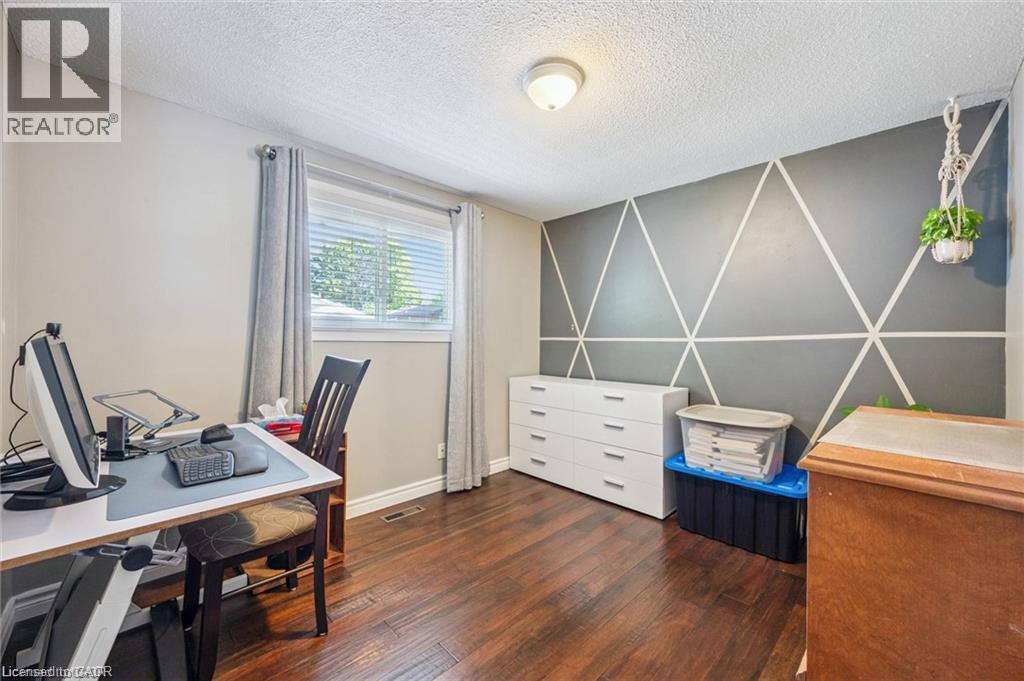 Wood-finish flooring, white baseboards, and a window with horizontal blinds - 659 Glen Forrest Boulevard, Waterloo, ON - Indoor Photo Showing Office
