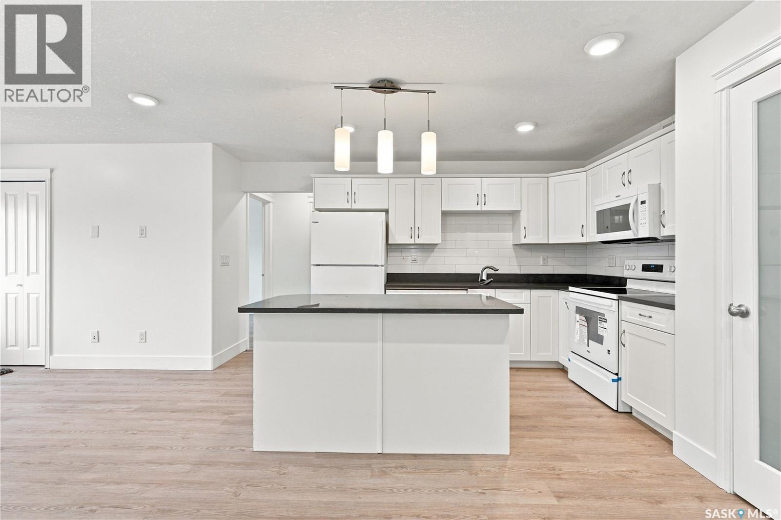 501 110 Akhtar Bend, Saskatoon, SK - Indoor Photo Showing Kitchen With Double Sink