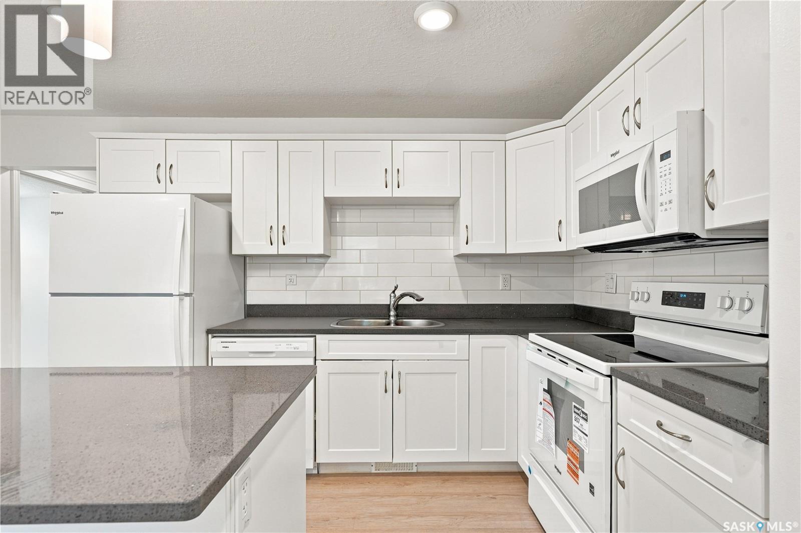 501 110 Akhtar Bend, Saskatoon, SK - Indoor Photo Showing Kitchen With Double Sink