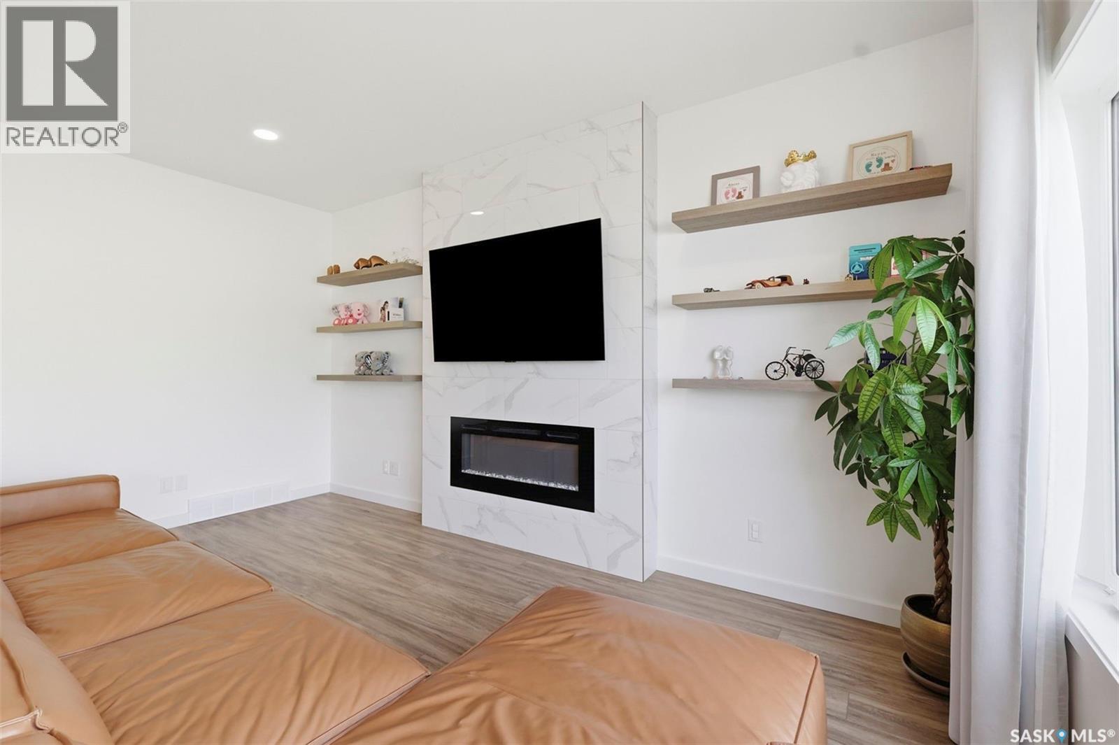 421 Germain Manor, Saskatoon, SK - Indoor Photo Showing Living Room With Fireplace