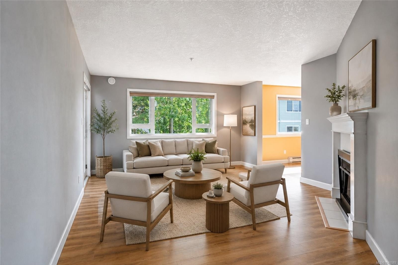 #302-9975 Fifth St, Sidney, BC - Indoor Photo Showing Living Room With Fireplace