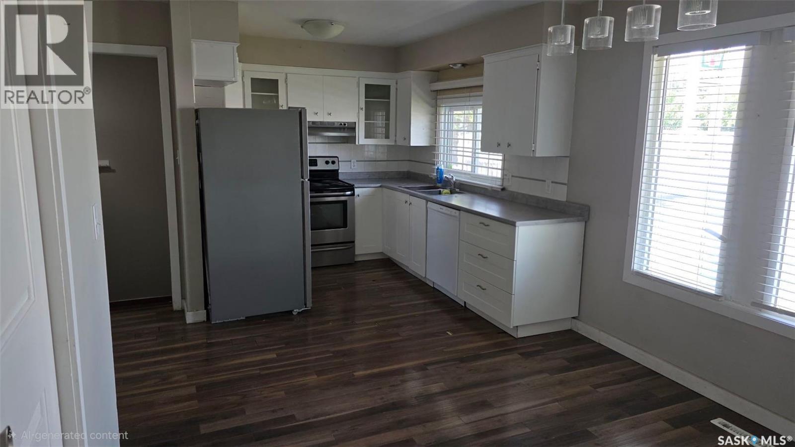 215 Central Street W, Warman, SK - Indoor Photo Showing Kitchen With Double Sink