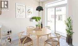 White painted walls, tile flooring, and a contemporary pendant light fixture - 