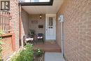 Brick exterior with covered front entry and a wood-finish porch - 230 Sunset Boulevard, Cambridge, ON  - Outdoor 