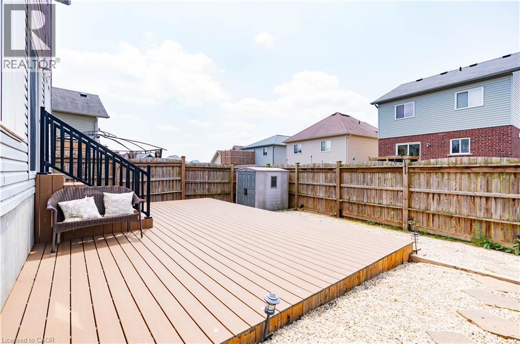 Expansive outdoor deck with a dark railing and integrated steps - 122 Iron Gate Street, Kitchener, ON - Outdoor With Deck Patio Veranda With Exterior