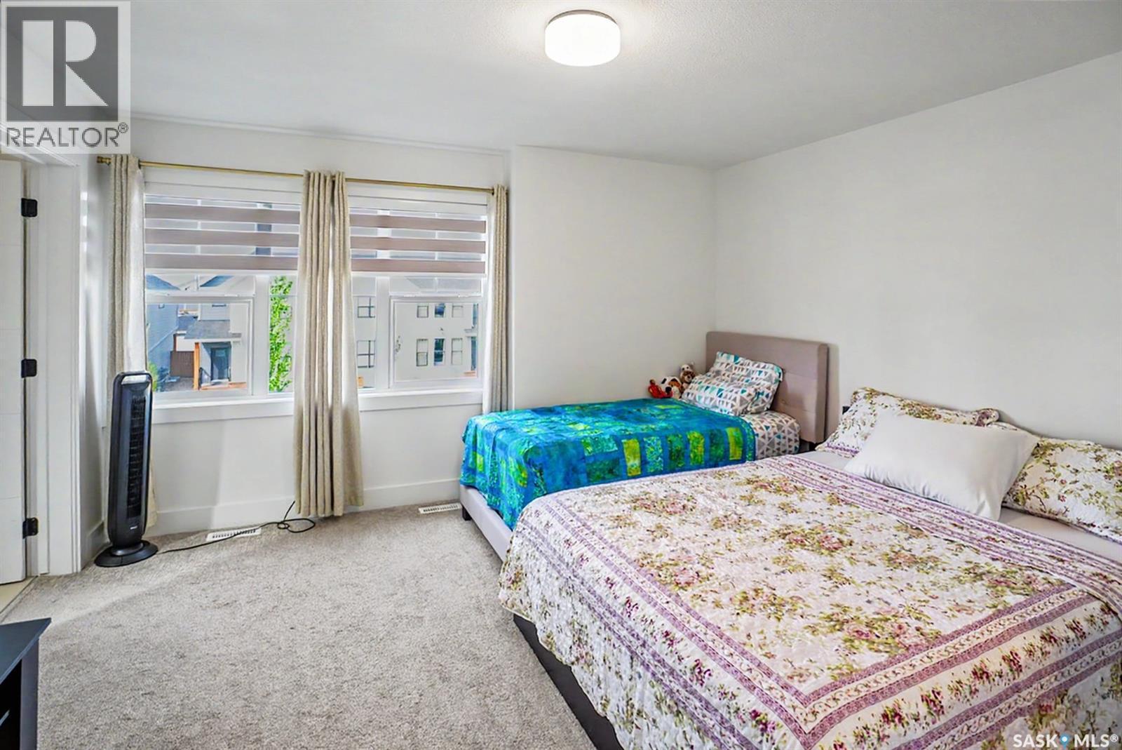 138 Rosewood Boulevard E, Saskatoon, SK - Indoor Photo Showing Bedroom