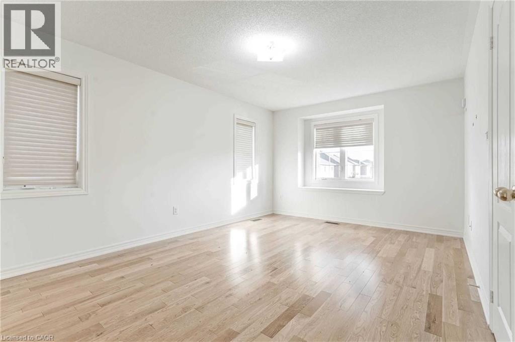 Empty room featuring light wood finished floors and a textured ceiling - 3 Coolwater Drive Unit# Upper, Brampton, ON - Indoor Photo Showing Other Room