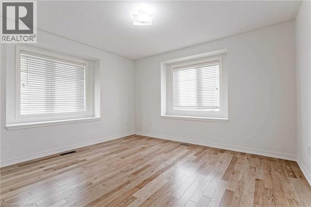 Spare room featuring light wood-style flooring and baseboards - 3 Coolwater Drive Unit# Upper, Brampton, ON - Indoor Photo Showing Other Room