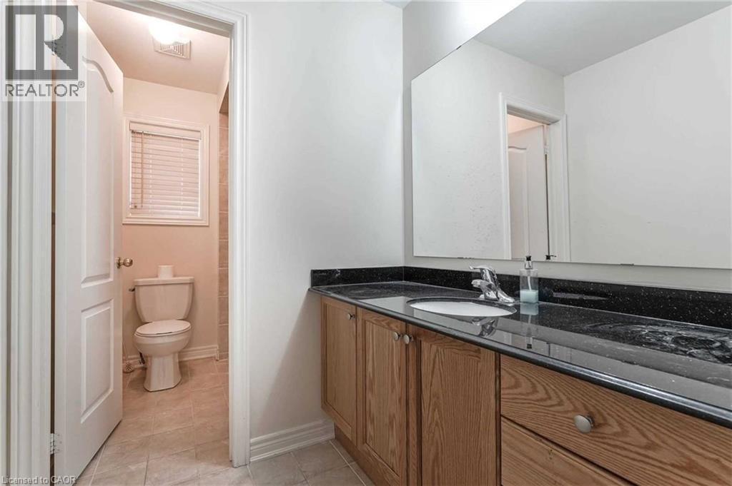 Full bath featuring vanity and tile patterned floors - 3 Coolwater Drive Unit# Upper, Brampton, ON - Indoor Photo Showing Bathroom