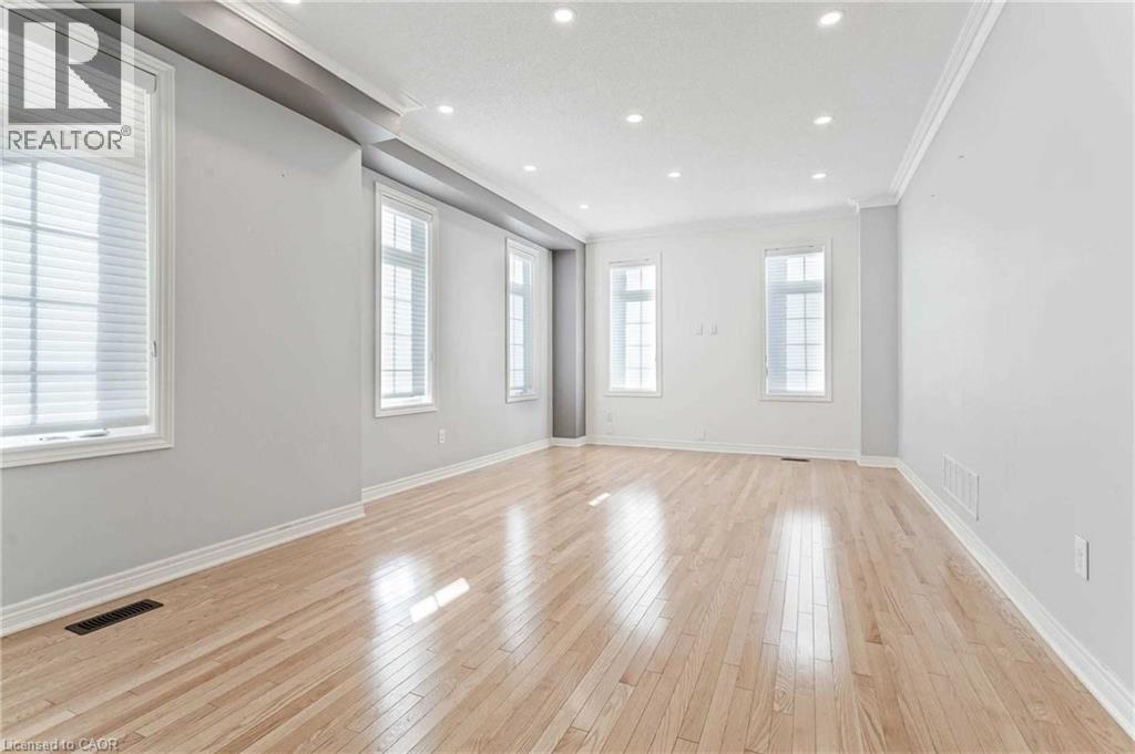 Spare room featuring crown molding, light wood-style floors, and recessed lighting - 3 Coolwater Drive Unit# Upper, Brampton, ON - Indoor Photo Showing Other Room