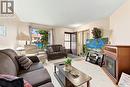 386 Cedar Meadow Drive, Regina, SK  - Indoor Photo Showing Living Room With Fireplace 
