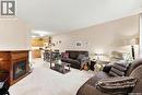 386 Cedar Meadow Drive, Regina, SK  - Indoor Photo Showing Living Room With Fireplace 