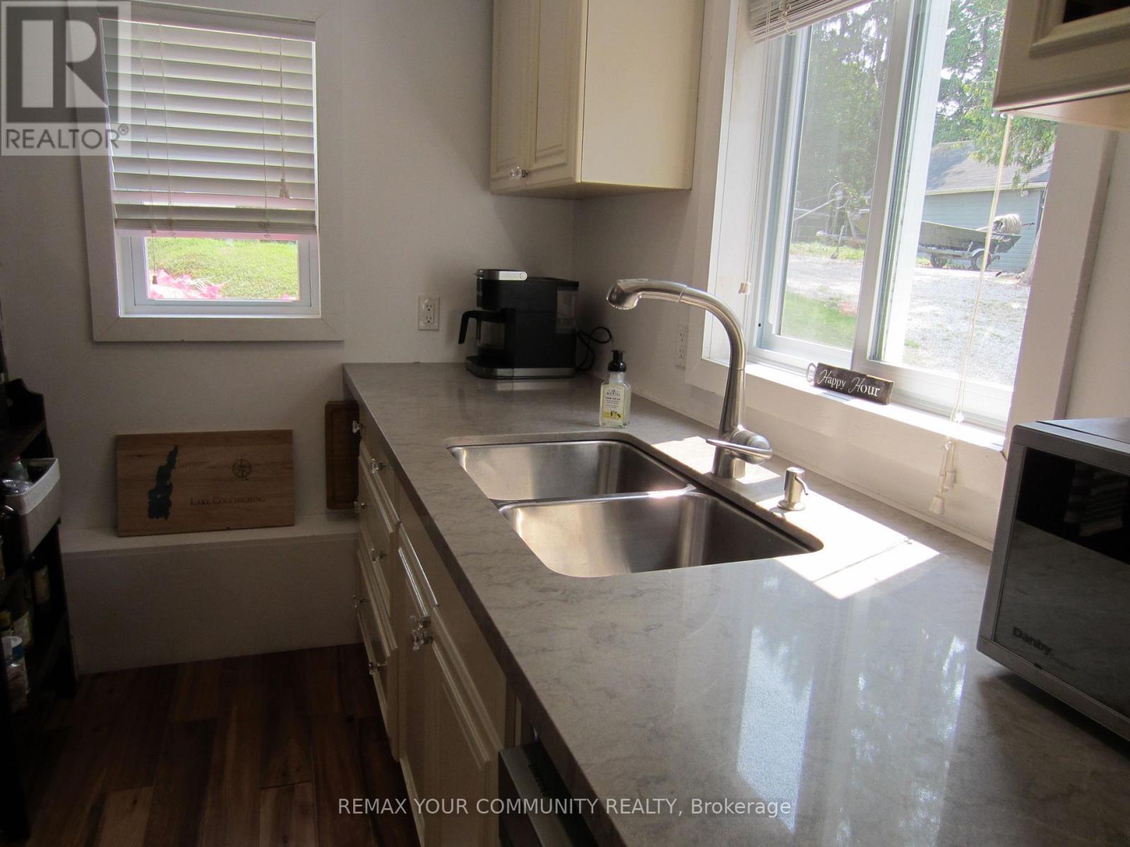 Kitchen/door to Recycle&Garbage Bins - 6576 Quarry Point Road, Ramara, ON - Indoor Photo Showing Kitchen With Double Sink