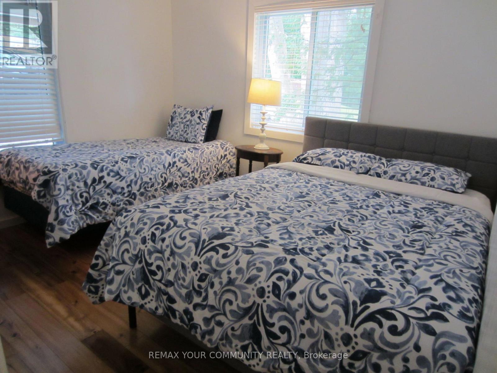 Bedroom#3 with Queen and Twin Beds - 6576 Quarry Point Road, Ramara, ON - Indoor Photo Showing Bedroom