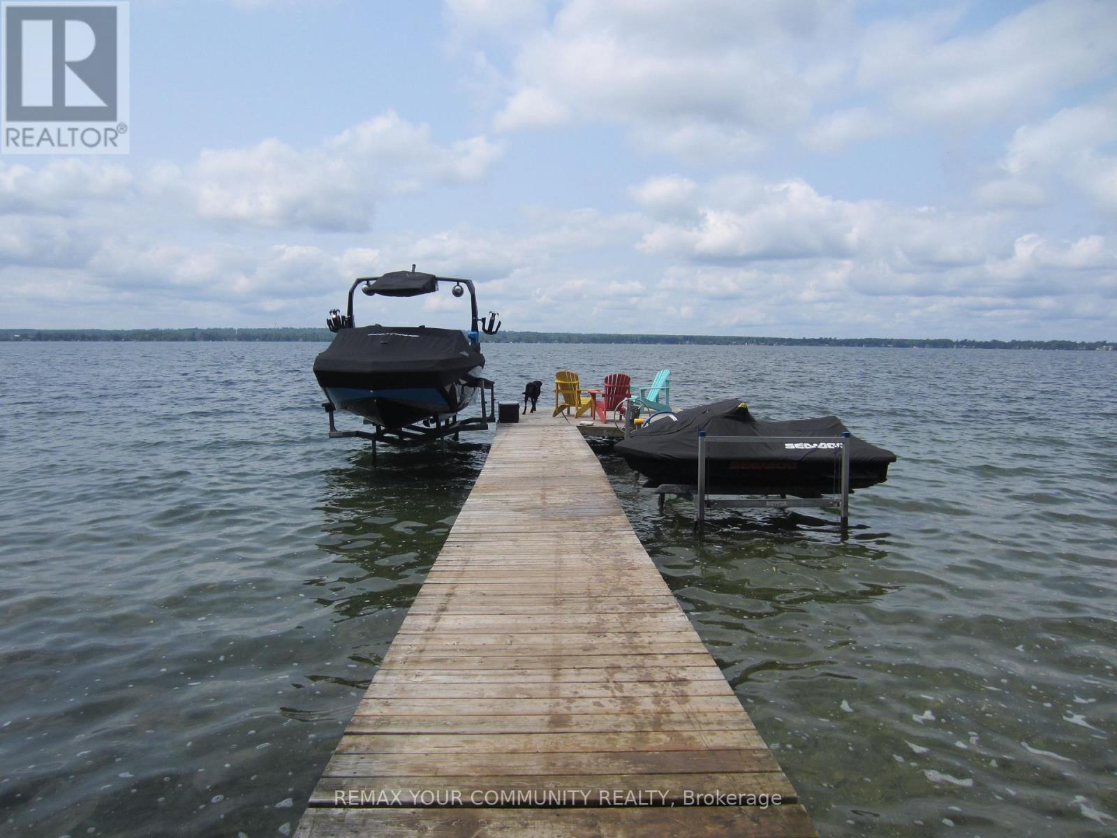 Great Dock - deep water boating,fishing,swimming - 6576 Quarry Point Road, Ramara, ON - Outdoor With Body Of Water With View